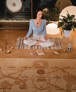 a-young-woman-sits-in-the-lotus-position-before-th-2025-03-24-23-13-13-utc.jpg