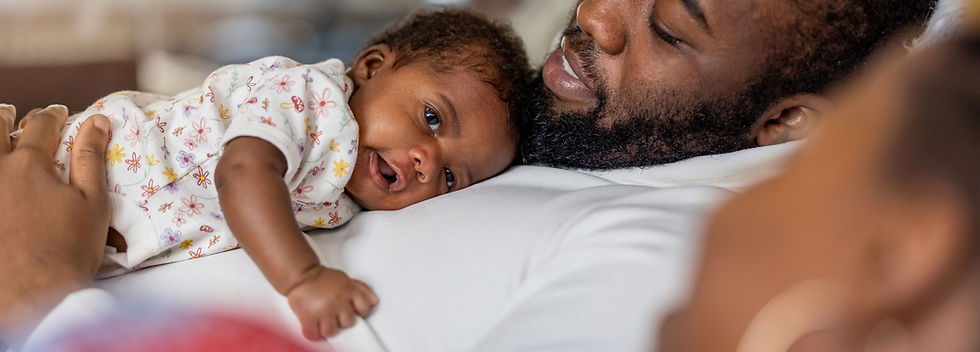 Father holding his newborn baby _.jpg