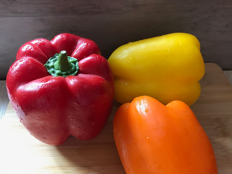 red, orange and yellow bell peppers