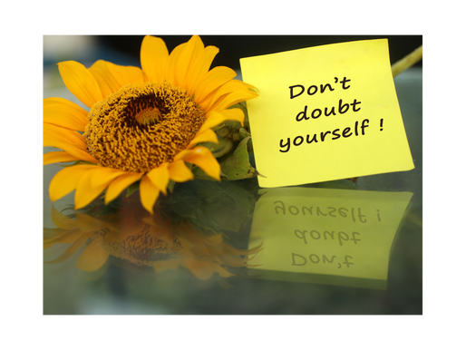 A picture of a sunflower with post it note that says Don't Doubt Yourself