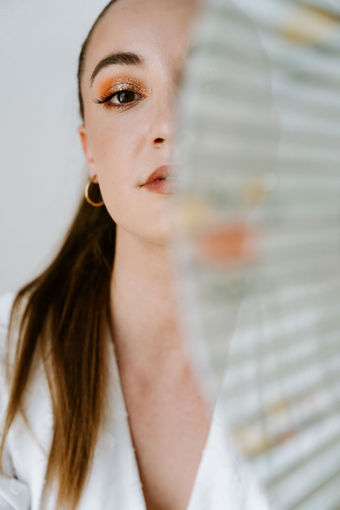 Editorial makeup look with polished glowing finish