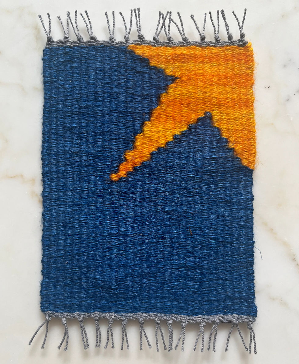 Mug rug woven on a frame loom.