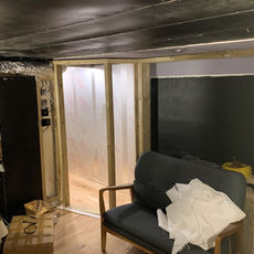 Door framing and grey sofa