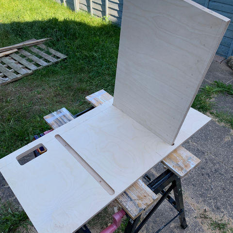 Plywood cabinet unit roughly assembled outside