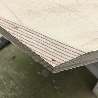 close up of planned angeled edges on plywood sheet
