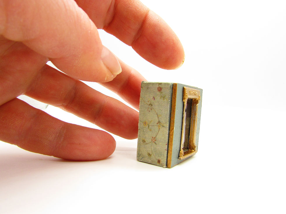 Thumbnail: Tiny boxed doll.