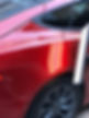 Red car's rear and profile