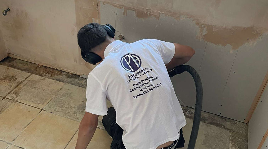 Person vacuuming a floor