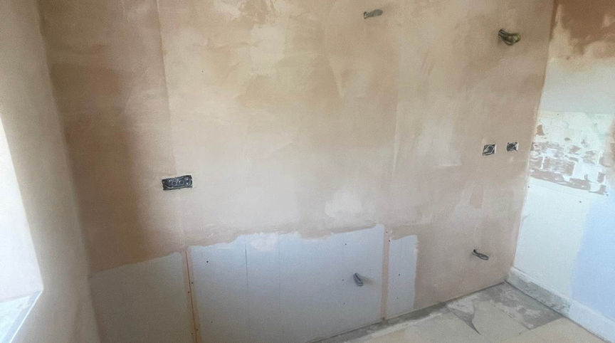 Bare wall with electrical outlets