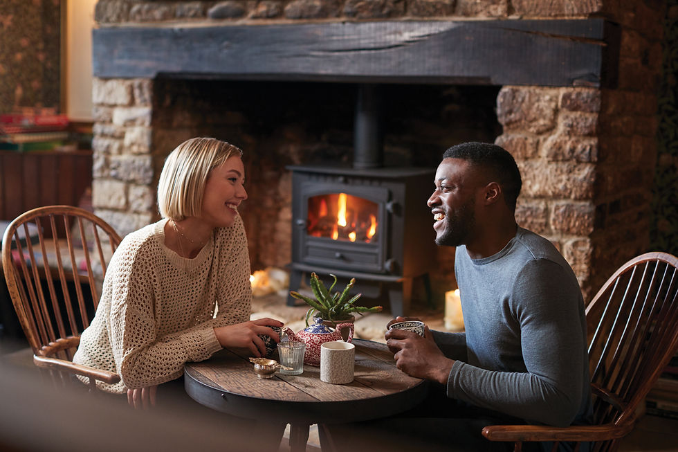 Couple next to nice old fire