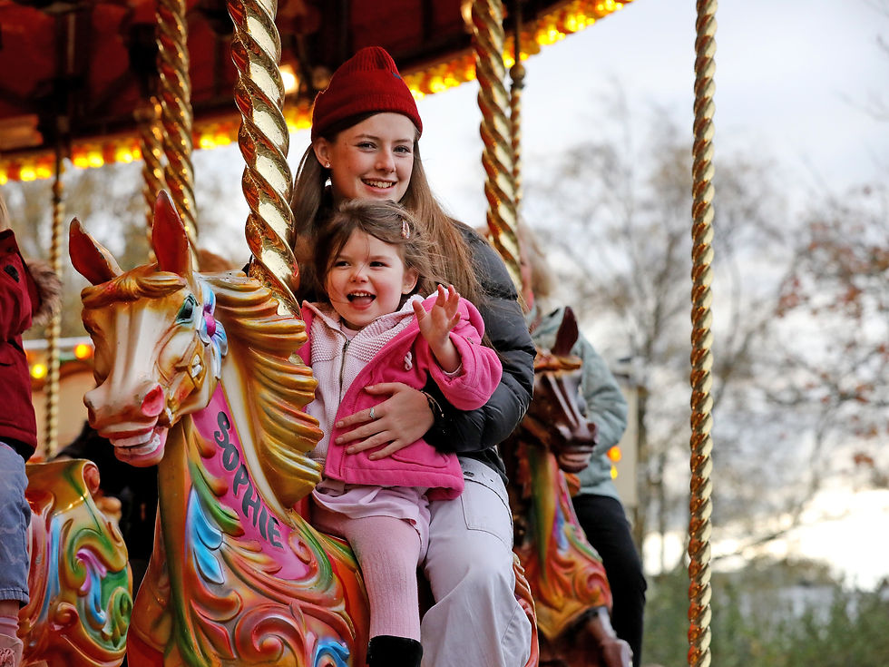 Kids having fun on the merry go round.