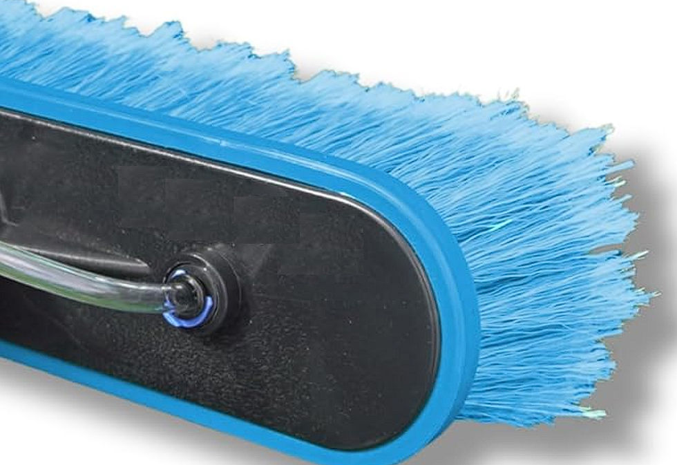Synthetic hard bristles. Effective at lifting dirt? Yes. Safe for the coating? Hardly.