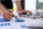 businesswoman-holding-graph-pen-to-analyze-marketi-2025-02-19-10-14-12-utc.jpg