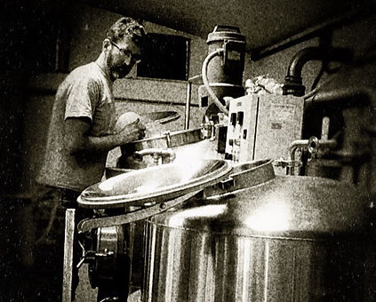 Brewer adding hops
