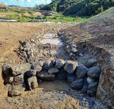 Stream diversion and rock protection works alongside earthworks site