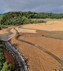 Shaped earth channels and sediment management features on large earthworks site