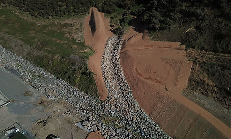 Steep batter stabilisation with rock protection during civil earthworks
