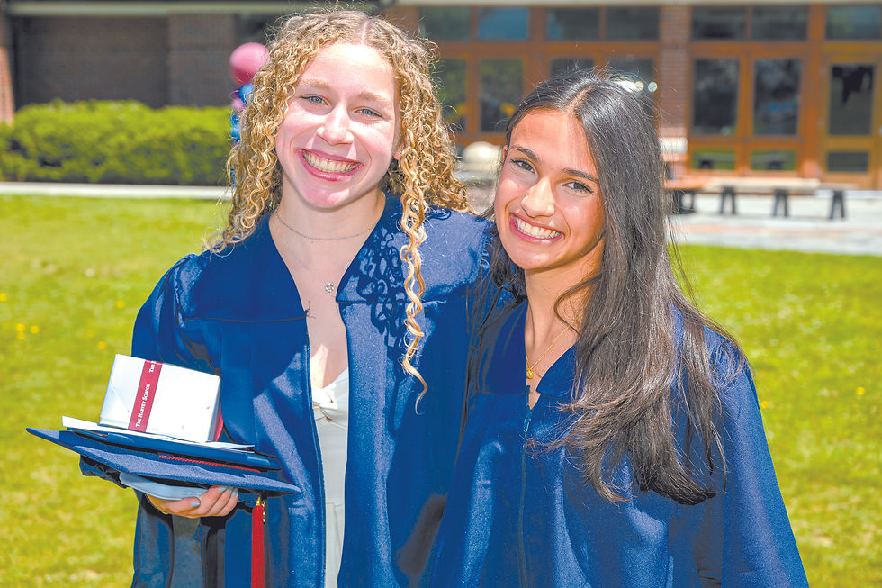 Grads Molly Weisberger and Elena Pagan are all smiles after the ceremony.