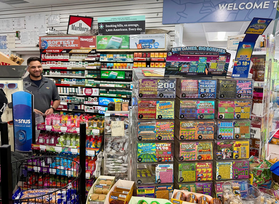 A clerk at the A Plus Mini Mart in Bedford Hills, and the lottery ticket display. THANE GRAUEL PHOTO