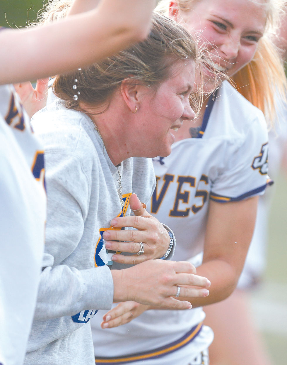 John Jay coach Jess McDonough gets a Gatorade bath from her team after recording her 150th career win with the program. JIM MACLEAN PHOTOS
