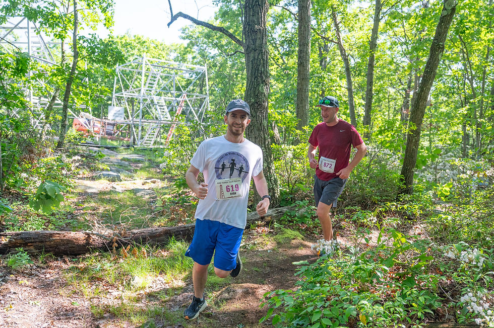 Ryan Carberry of Katonah and Steve Moore of Holmes NY pass by the fire tower under construction.