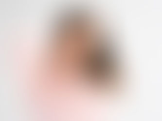 Women holding her neck with expression of pain on her face