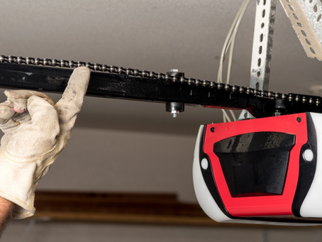 Technician repairing a garage door opener