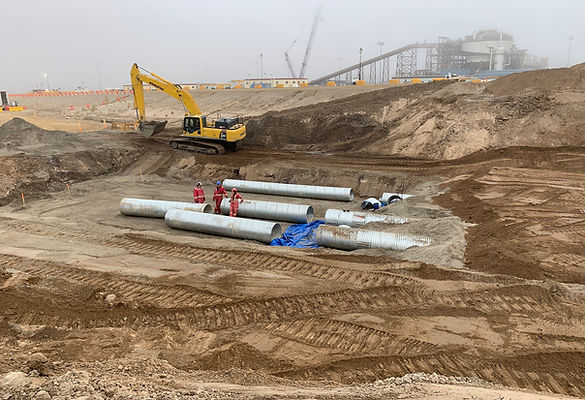 Earthmoving equipment preparing an industrial construction site