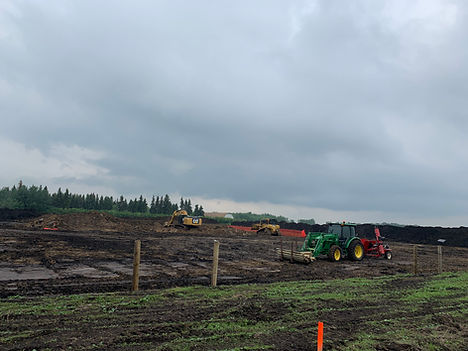 Pipeline installation work with heavy machinery on prepared ground