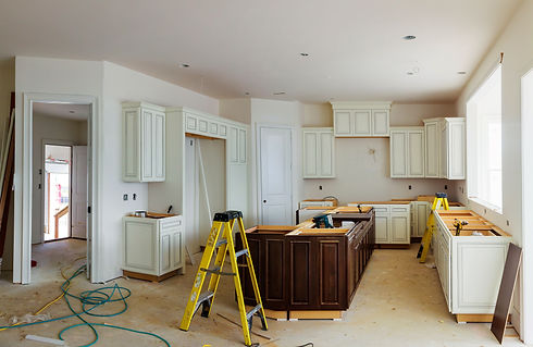 Custom kitchen cabinets in various stages of installation