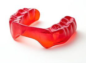 Red dental protector on a white backdrop
