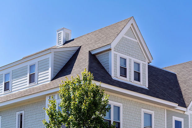 Dormer windows on the sloped shingle roof