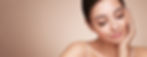 A woman with closed eyes gently smiles