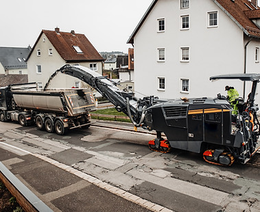 Road Milling Machine Removing Asphalt Surface