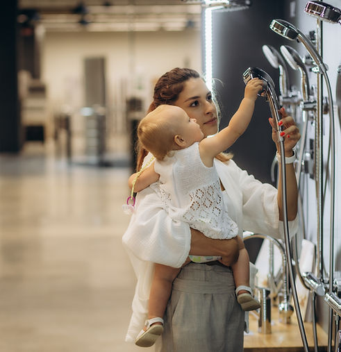 mother and daughter choose a shower in the store
