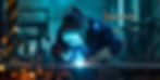 Skilled Welder works in a fabrication shop welding metal work