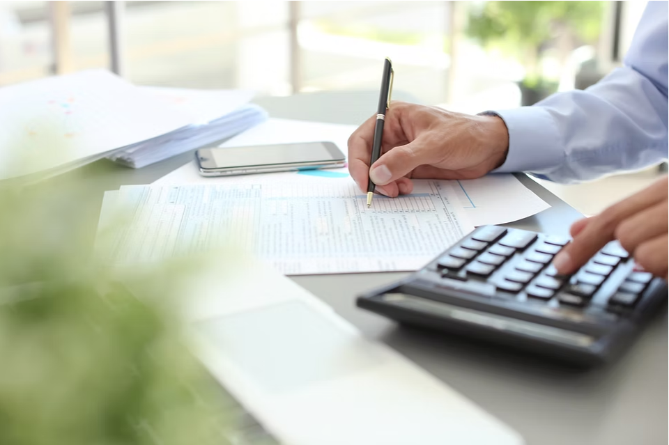 Close-up of hands working at a desk