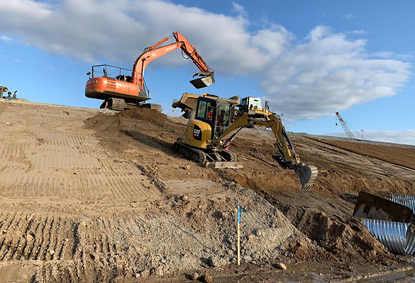 Excavators carrying out site reclamation and earthmoving operations