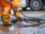 Man pumping out house septic tank.