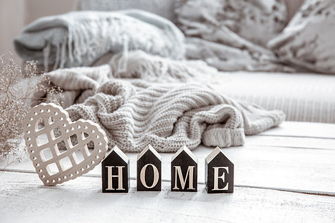 composition-hygge-style-with-wooden-word-home-heart-knitted-element.jpg