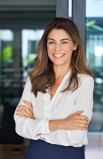 Happy cheerful 45 year old Latin professional mid aged business woman corporate leader, sm