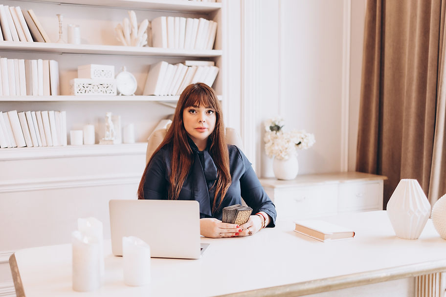 young woman plus size model in business clothes sit in white office or cabinet and work on