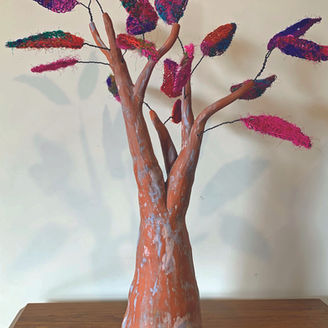 Ceramic tree sculpture with knitted fibre leaves