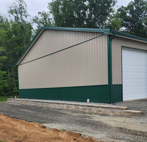 Paver retaining wall project on side of garage build