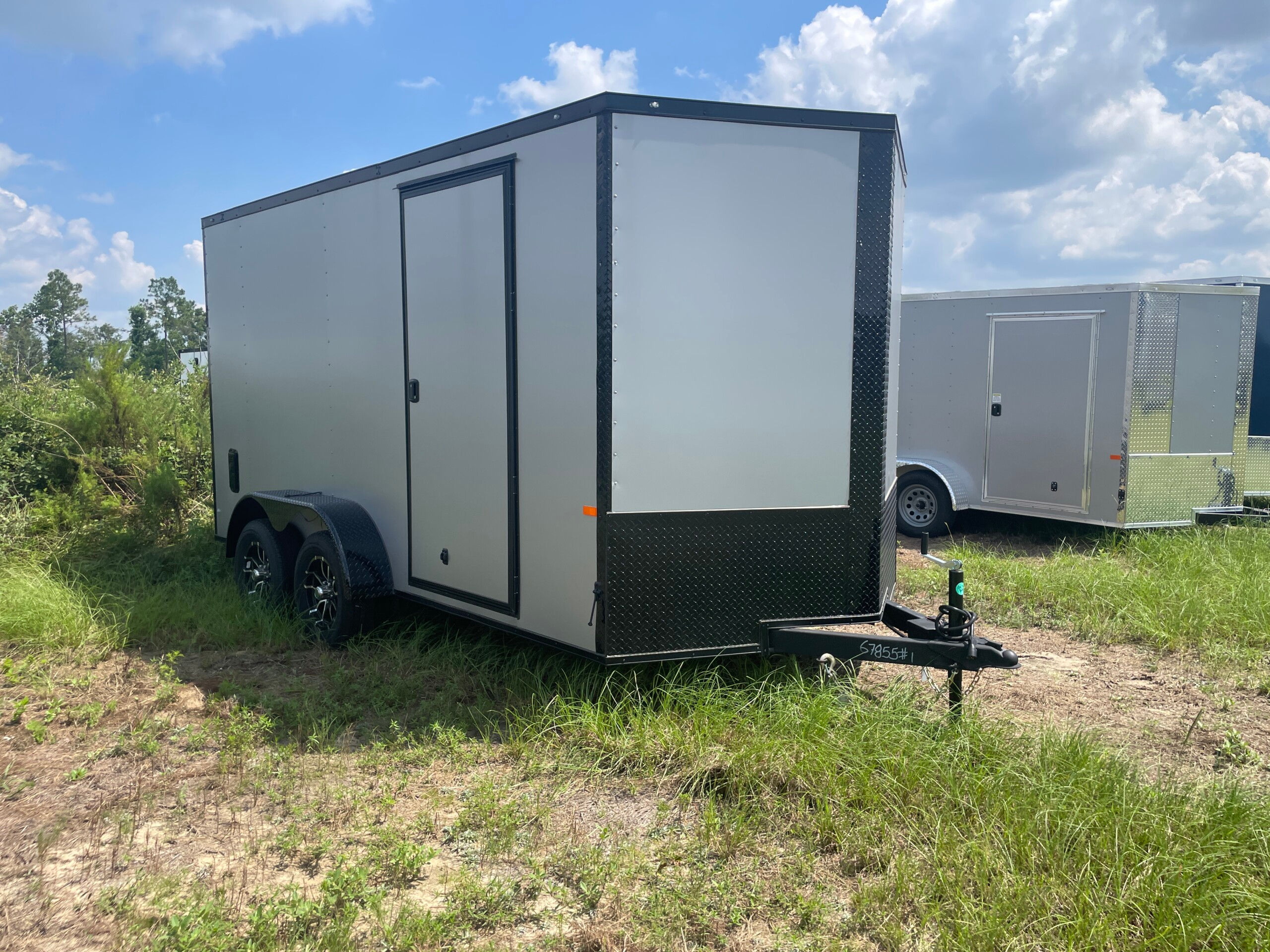 Rock Solid Cargo 7x14 enclosed cargo trailer with Silverfrost polycore exterior, blackout package, alloy wheels, and tandem axles for sale
