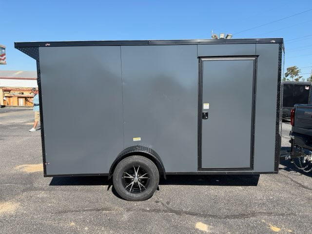 Deep South 6x12 enclosed trailer with charcoal Polycore exterior, blackout package, alloy wheels, spoiler, and ramp door.