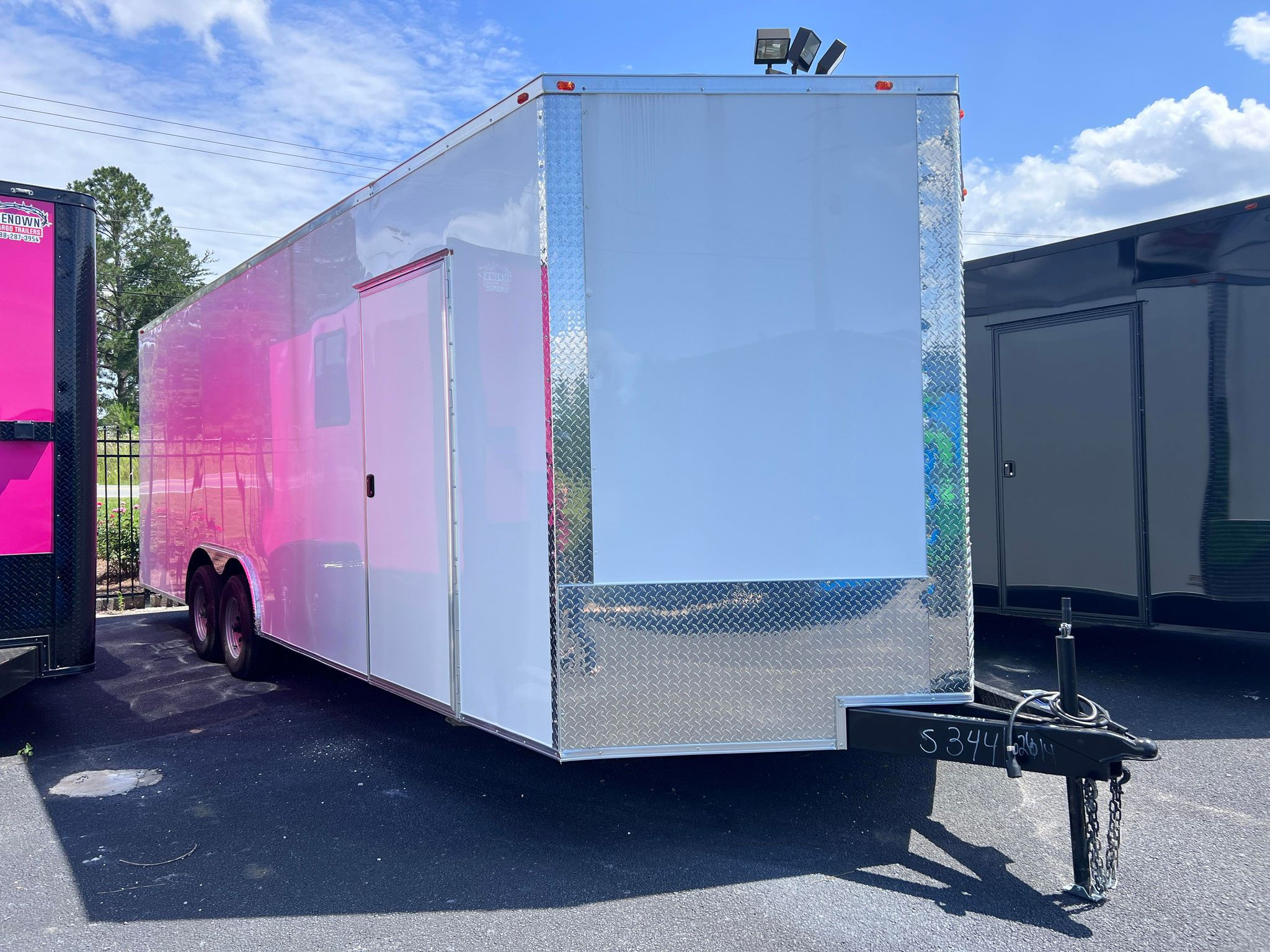 White Deep South 8.5x24 TA3 enclosed car hauler trailer with screwless polycore exterior.