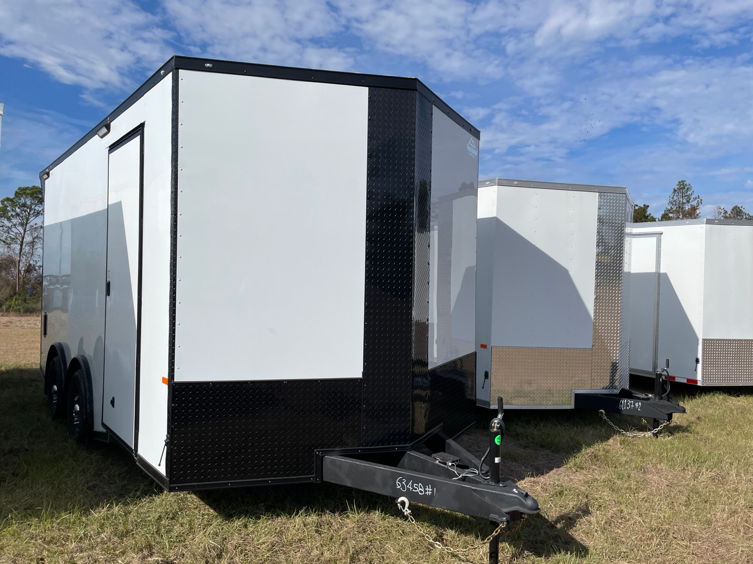 Rock Solid Cargo 8.5x16 enclosed cargo trailer with polycore exterior, blackout package, torsion spread axles, rear spoiler, and extended triple tube tongue for sale.
