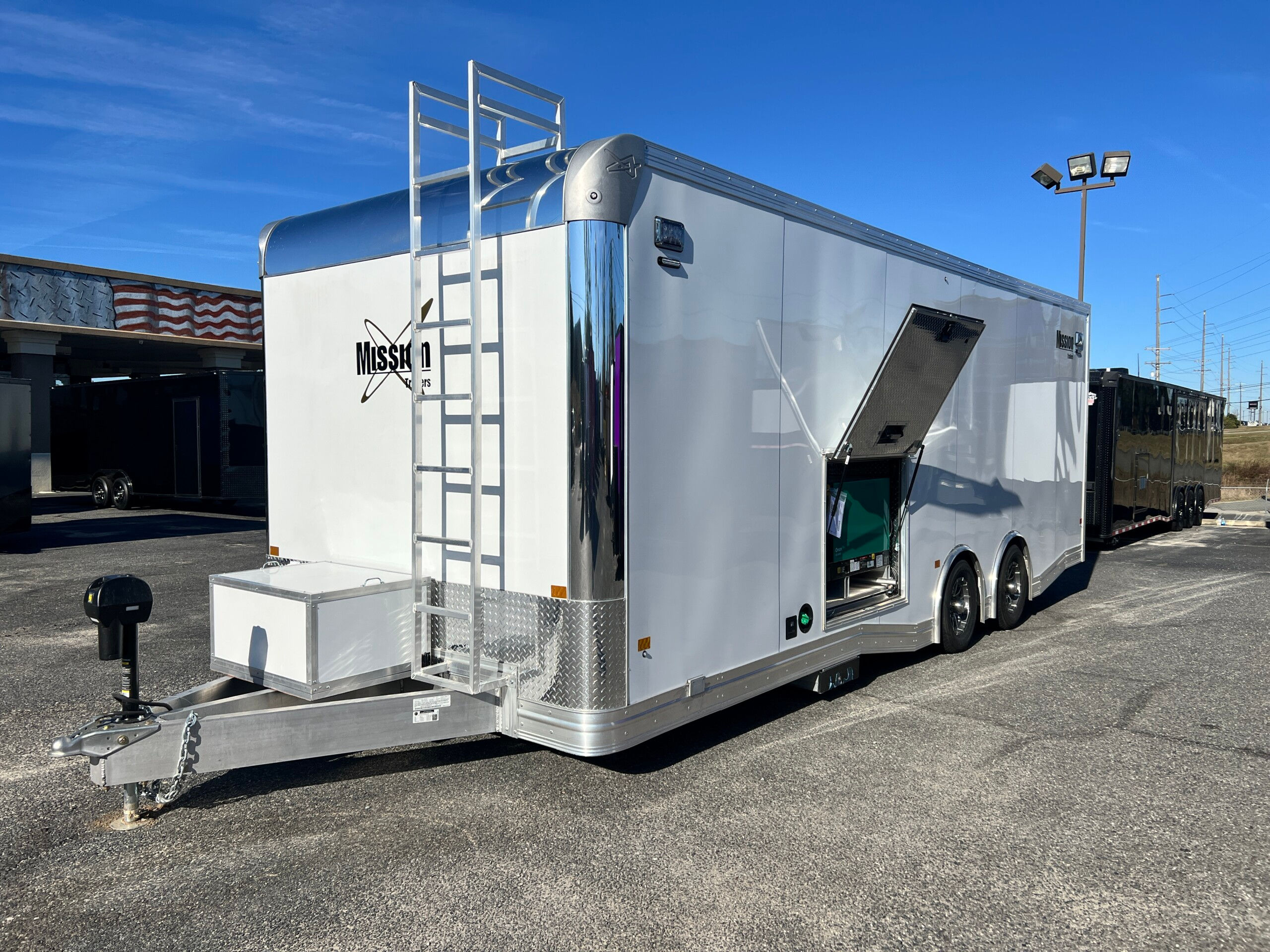 2025 mobile command trailer with aluminum construction, emergency lighting, generator system, command center interior, and communications equipment.