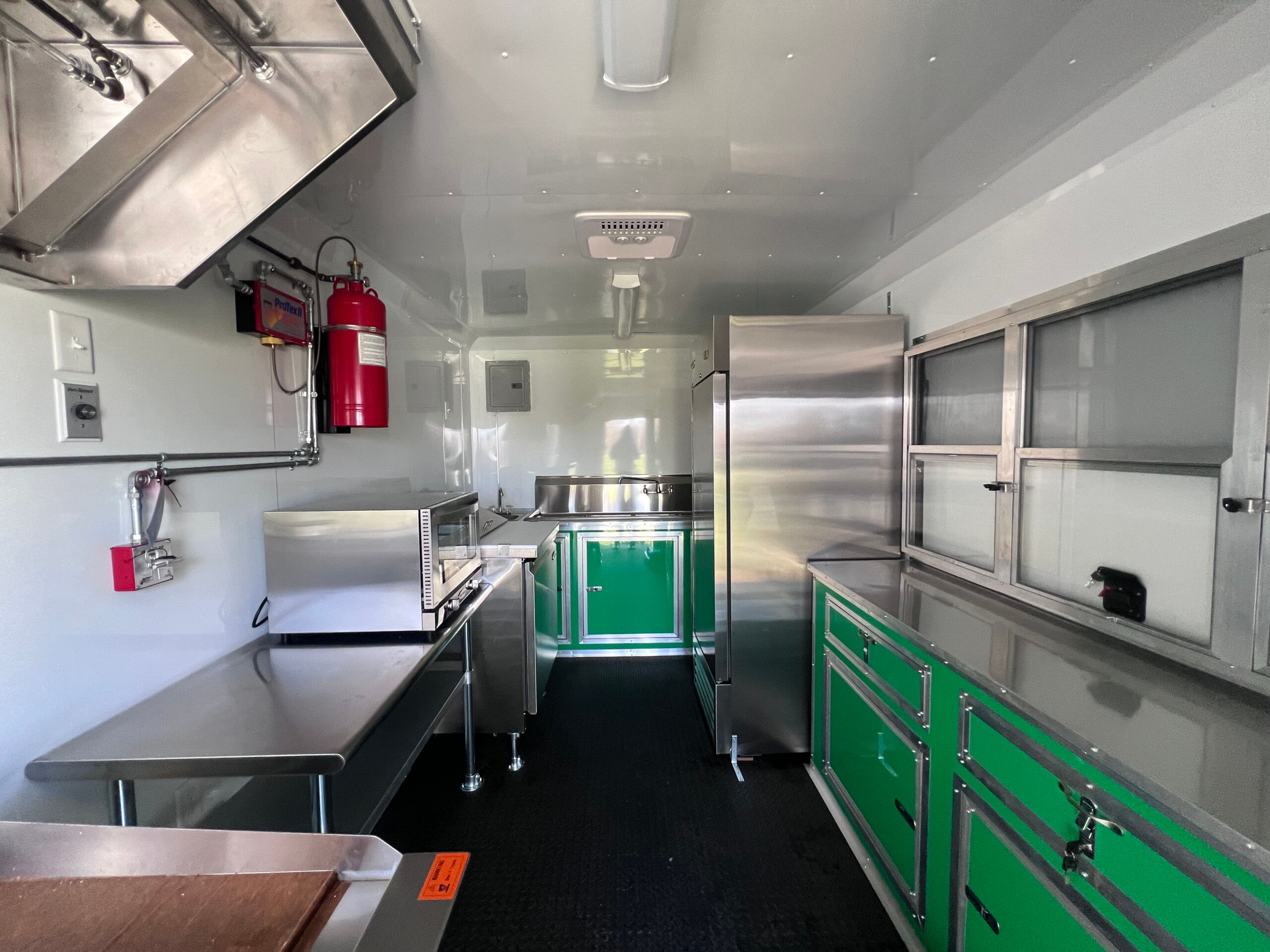 Piedmont Green Quality Cargo 8.5x16 TA3 mobile food concession trailer with blackout package and concession window.